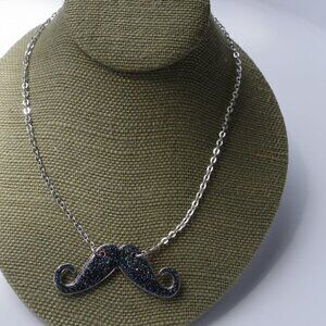Women`s silver tone glitter mustache necklace. 16